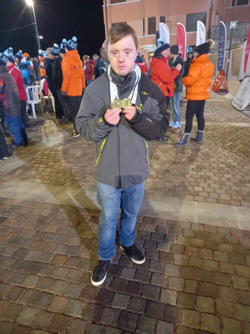 Richard stood with his medals